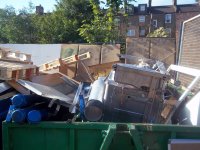 rubbish in green skip